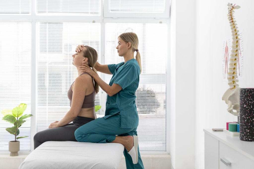 physiotherapist helping patient her clinic